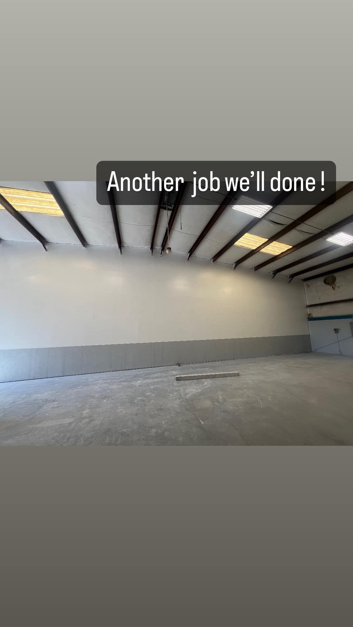 Freshly painted commercial warehouse interior in Jacksonville, FL by Strait Edge Painting